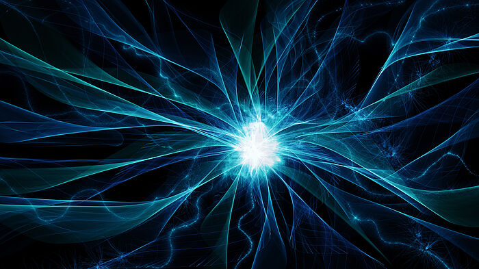 Bildlichtaufname eines Neutrones, Schwarzer Hintergrund und blau, türkis, weiße Lichtkugel mit Farbstrahlen in blau, weiß und türkis