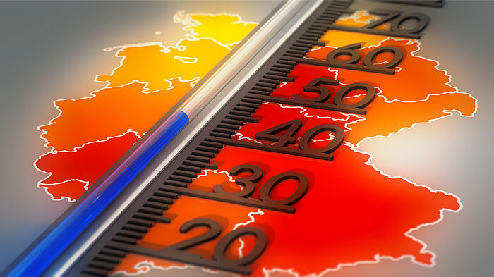 Thermometer auf Temperaturkarte von Deutschland